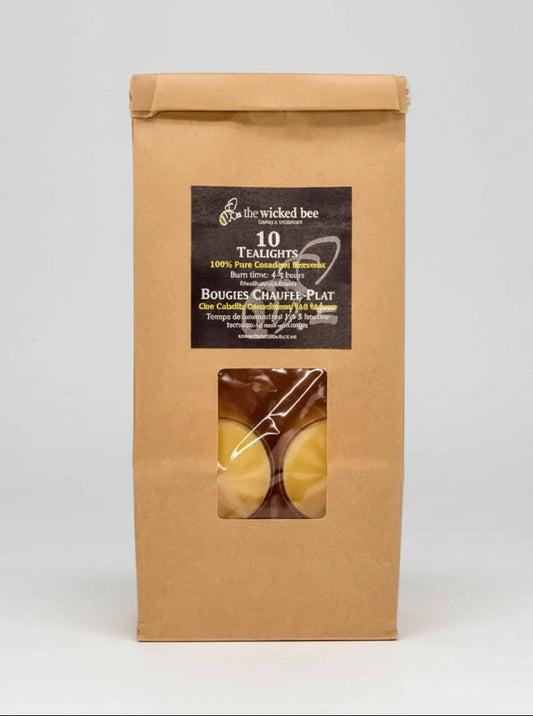 Kraft paper packaging with a window displaying Canadian Beeswax Tealights and a label on a white background