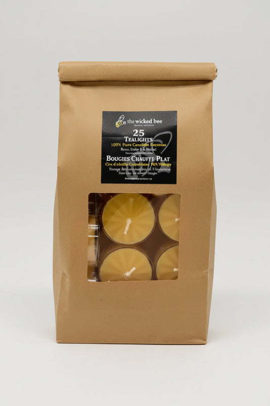 Kraft paper packaging with Pure Beeswax tea lights and a label on a white background